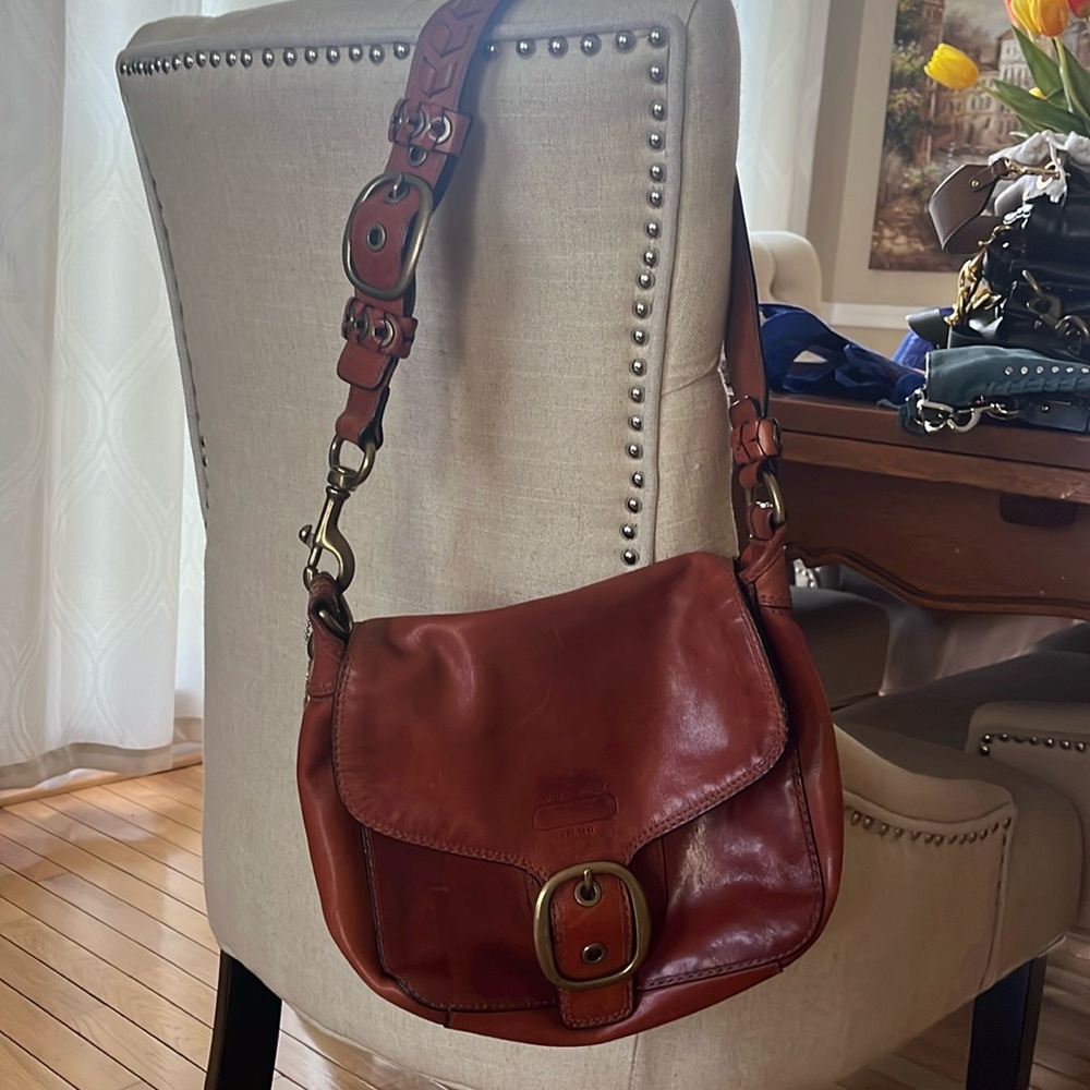 Brown leather Coach bag with back pocket
